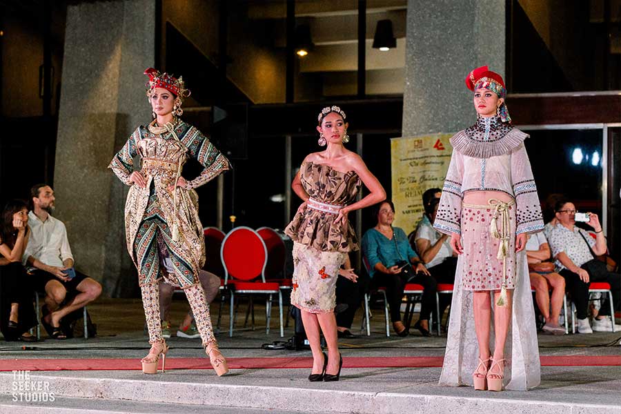 Three models in Amir Sali's collection, including Miss Negros Oriental 2024 in an embroidered ensemble with cultural patterns