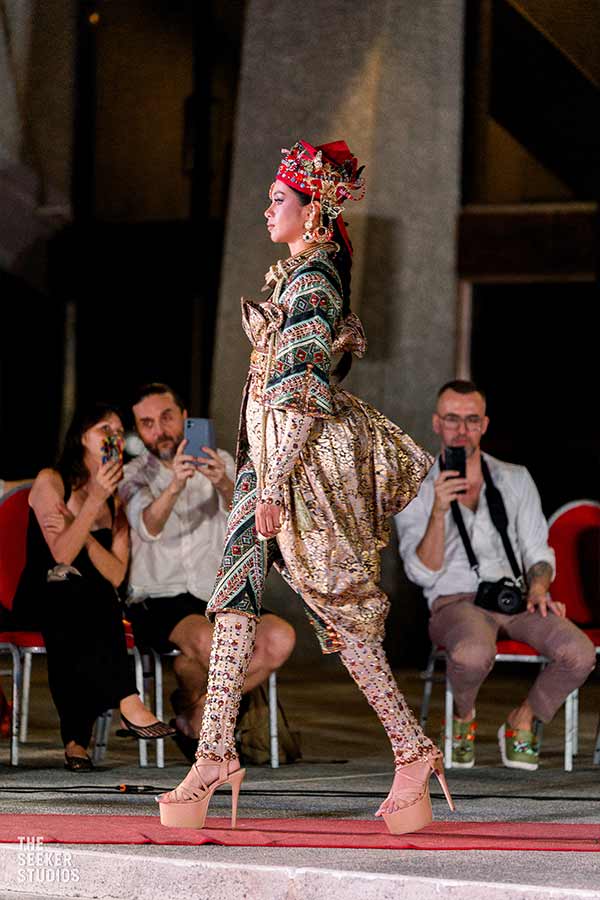 Miss Negros Oriental showcases a cultural-inspired Amir Sali ensemble, featuring detailed gold fabrics and a red headpiece