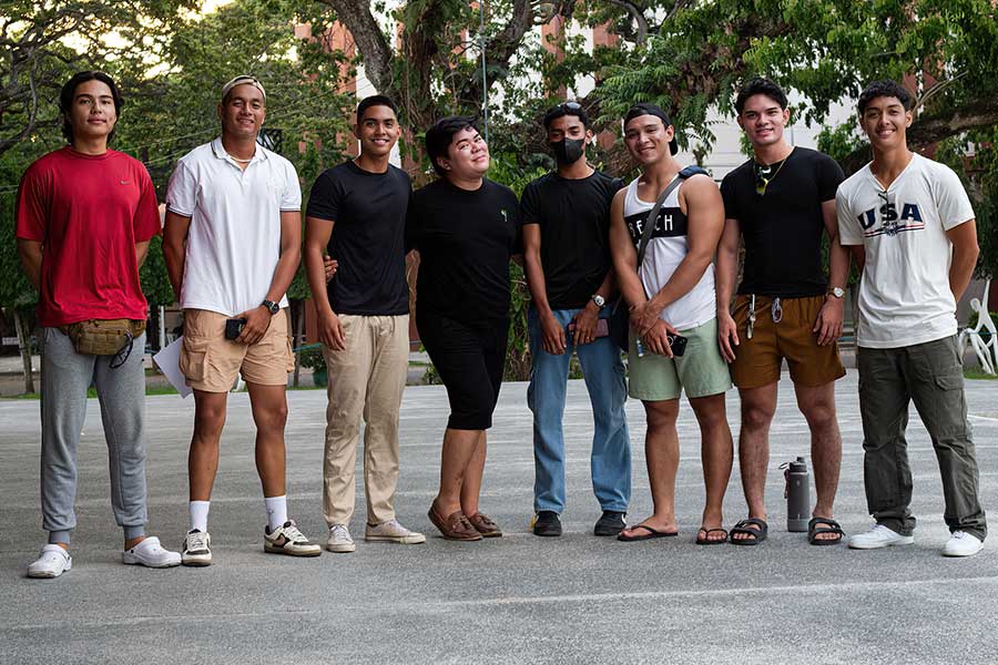 Models and their manager in a group photo during final rehearsals before the fashion show in Dumaguete