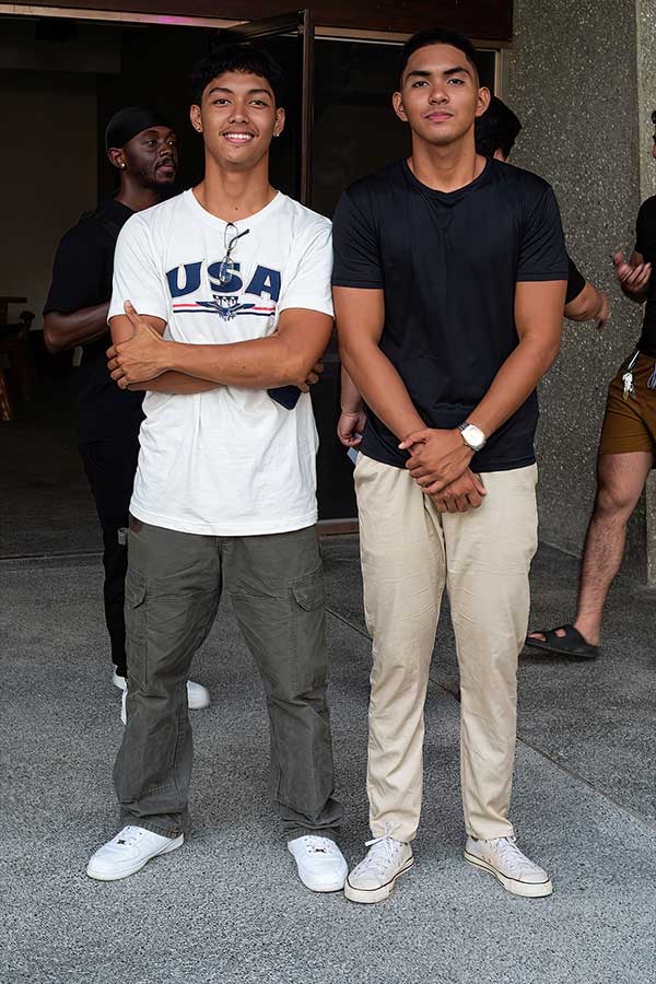 Two models pose for the camera backstage before the final rehearsals for the fashion show