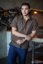 Young man in a brown short-sleeve shirt, modern casual style