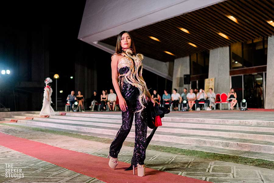Model in a sequined fringe jumpsuit at the fashion event in the Philippines