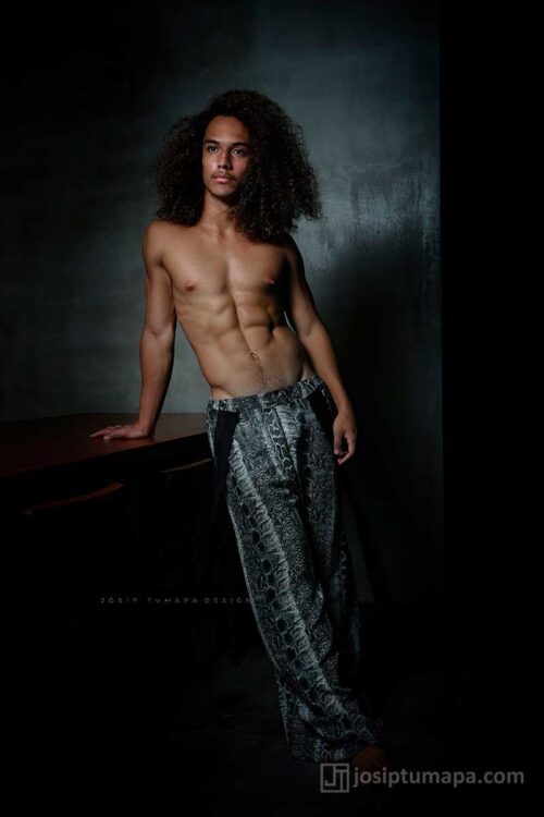 Modern resort menswear pants with relaxed structure, straight legs, and subtle pattern designed for everyday wear