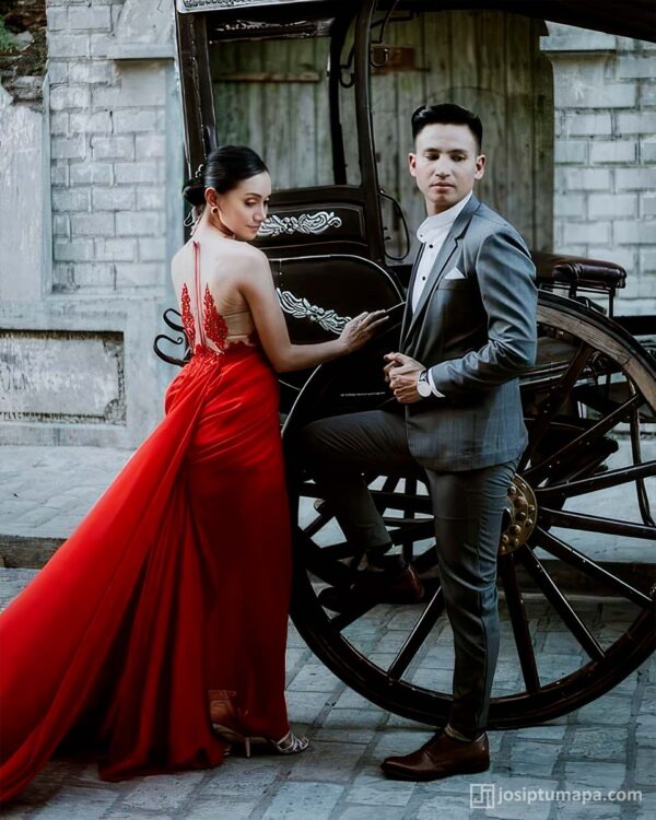 Couple by the carriage in elegant evening attire for special events, exclusively custom-made
