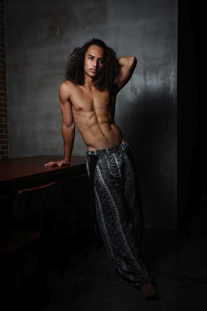 Straight-leg resort menswear pants with low-set waist and fluid drape, designed for comfort and ease of movement