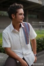 Side view of white tribal-accent shirt with casual styling