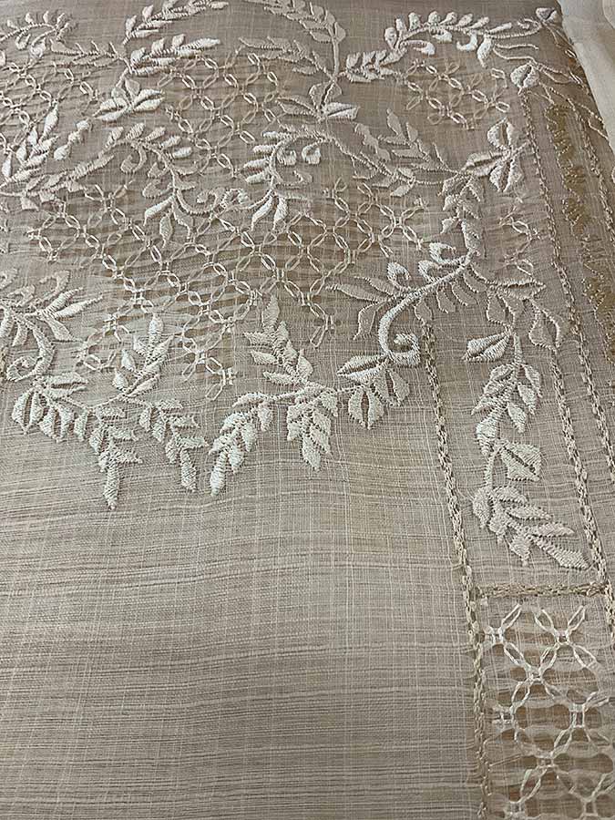 Piña cocoon textile of silk and pineapple fibers, machine-aided but featuring handmade calado embroidery