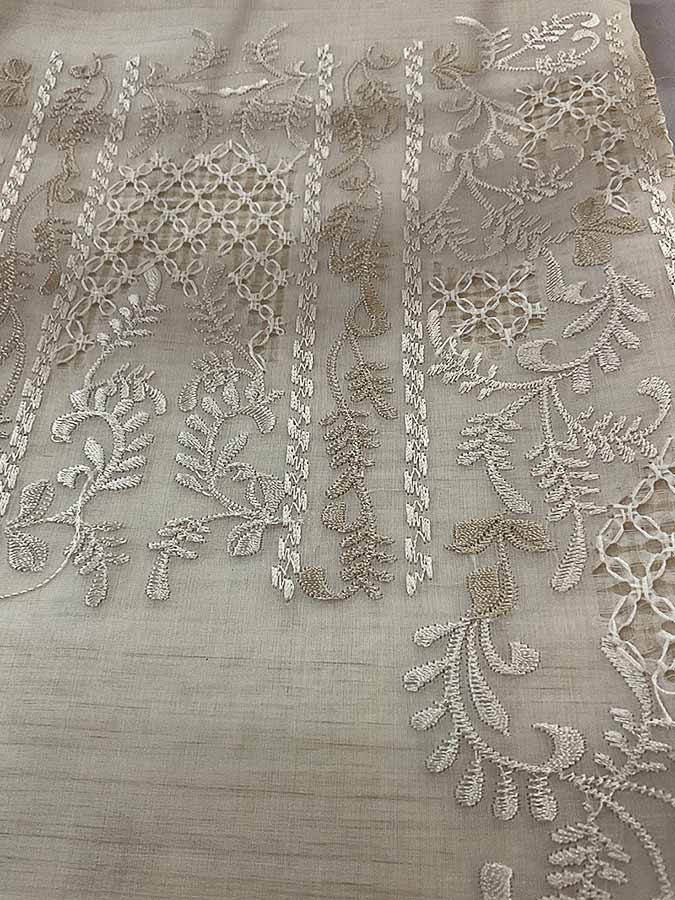 Piña cocoon silk fabric with smooth texture, blending silk and pineapple fibers, and calado hand embroidery
