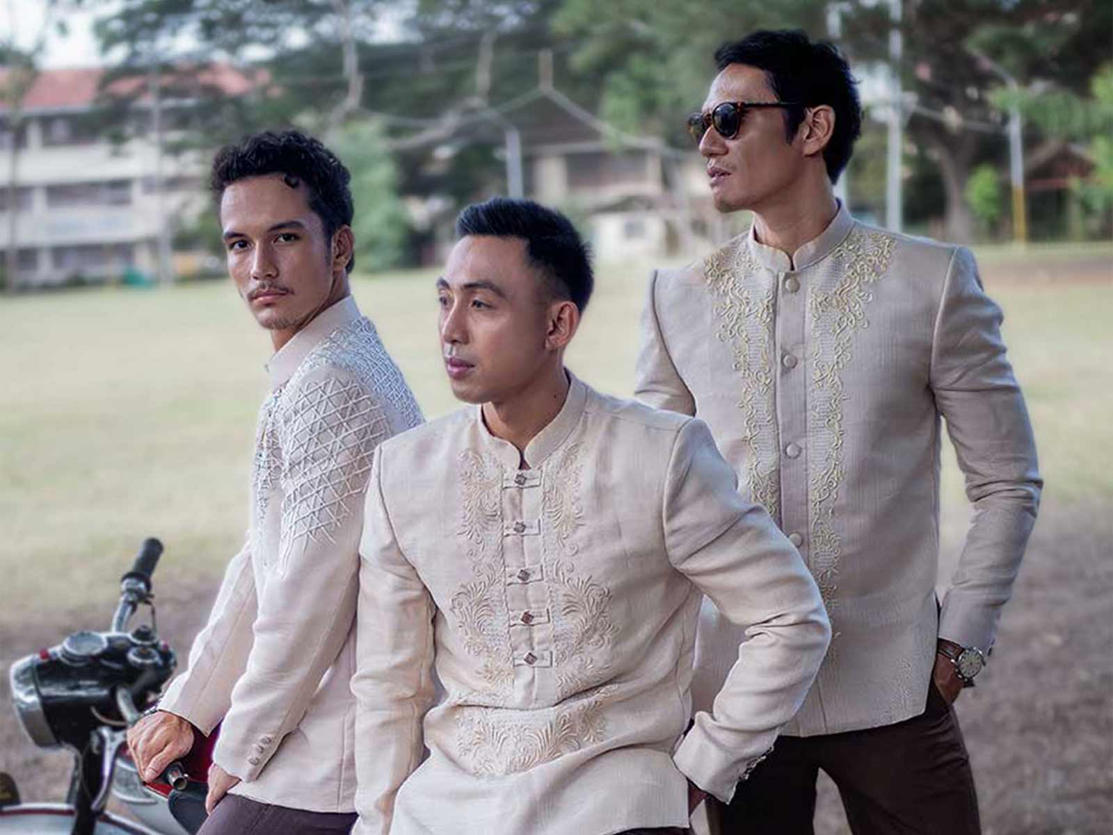 Three men wearing classic Barong Tagalog with hand embroidery outdoors