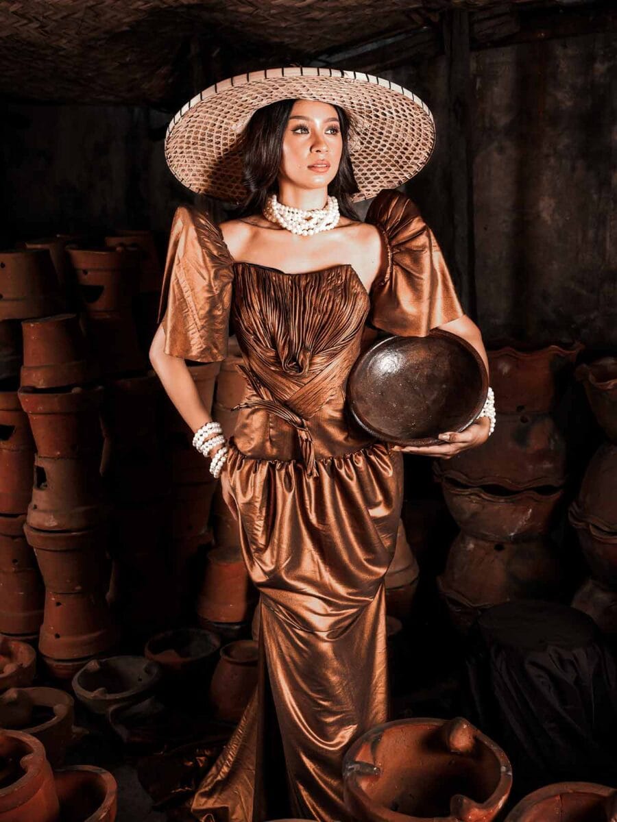 Modern Terno Filipiniana dress in bronze with butterfly sleeves and wide hat