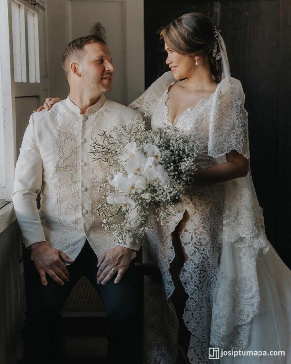 Bride and groom in matching Filipiniana gown and Piña Cocoon Silk Barong Tagalog indoors