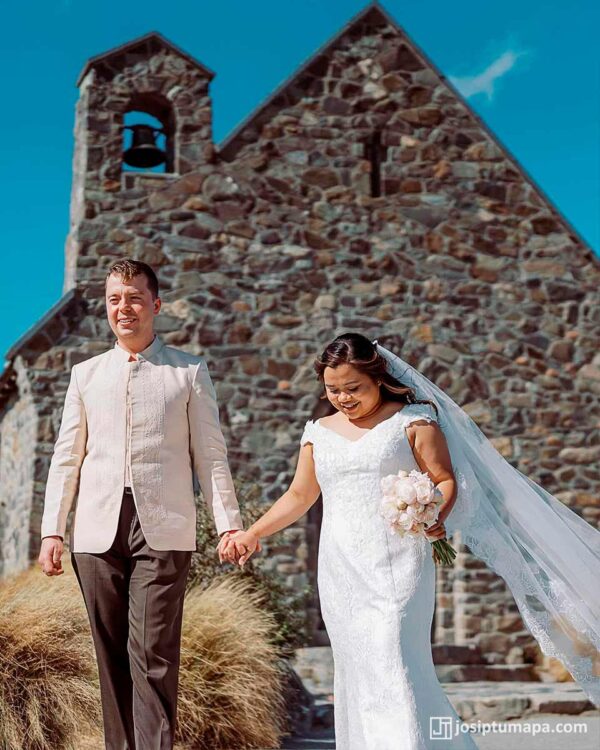 Couple walking after the ceremony in Barong Tagalog and classic bridal gown