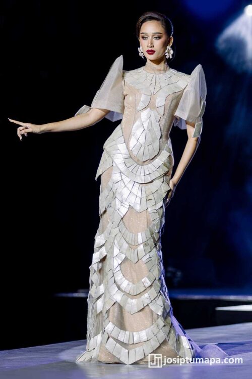 Contemporary Filipiniana dress highlighting defined bodice geometry and modern sleeve construction during runway presentation