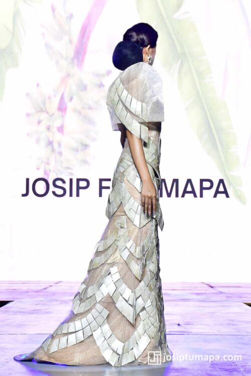 Layered Filipiniana dress shown from the back, featuring stepped geometric panels forming a continuous vertical line