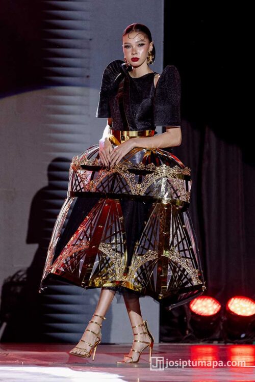 Contemporary Filipiniana terno with angular sleeves and gold-accented geometric skirt
