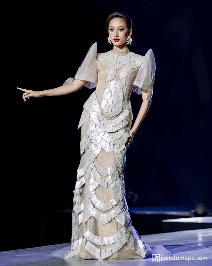 Contemporary Filipiniana dress highlighting defined bodice geometry and modern sleeve construction during runway presentation