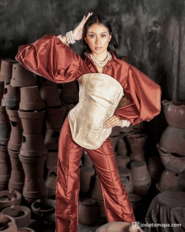 Modern Filipiniana ensemble with a piña cocoon silk corset and softened contemporary sleeves in a deep crimson tone