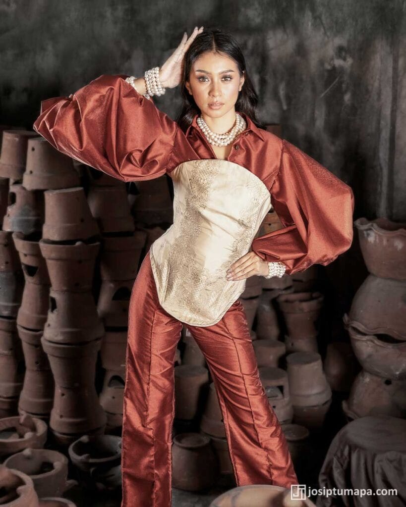Modern Filipiniana ensemble with a piña cocoon silk corset and softened contemporary sleeves in a deep crimson tone