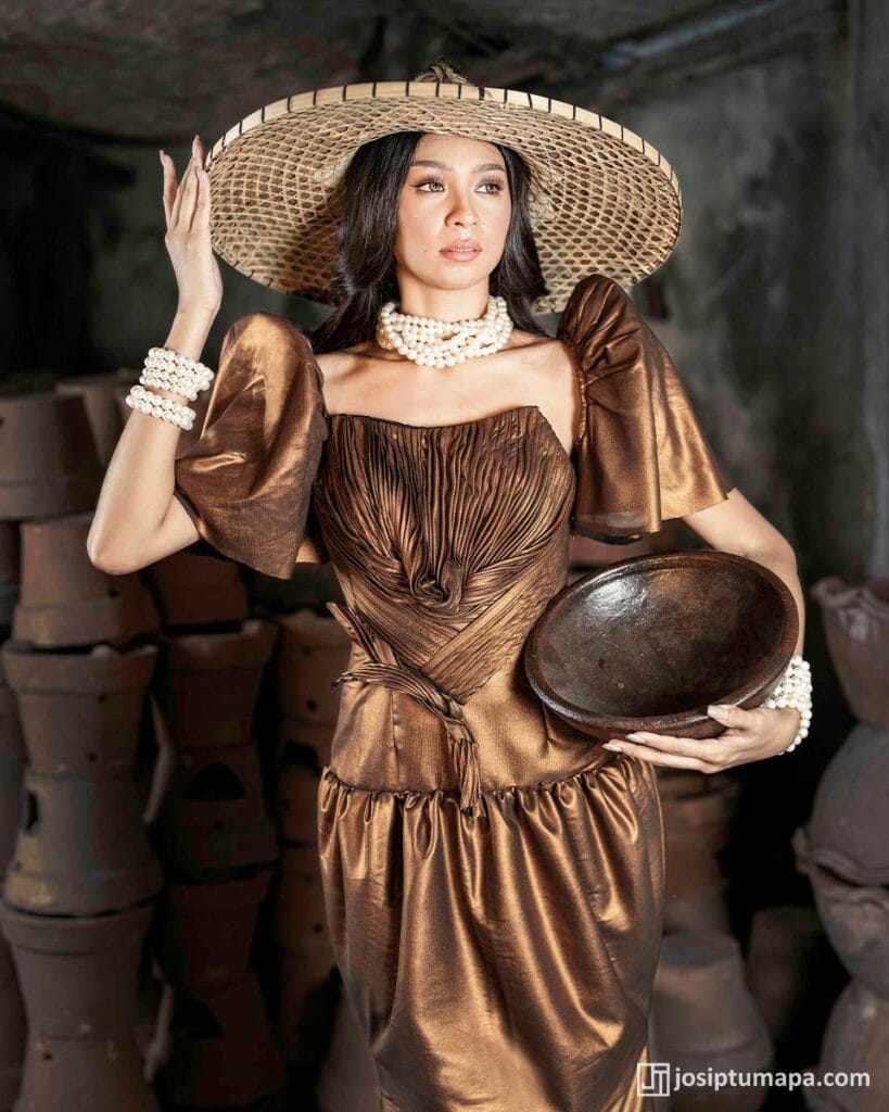Bronze Terno with ruched bodice, butterfly sleeves, woven hat, and layered pearl accessories