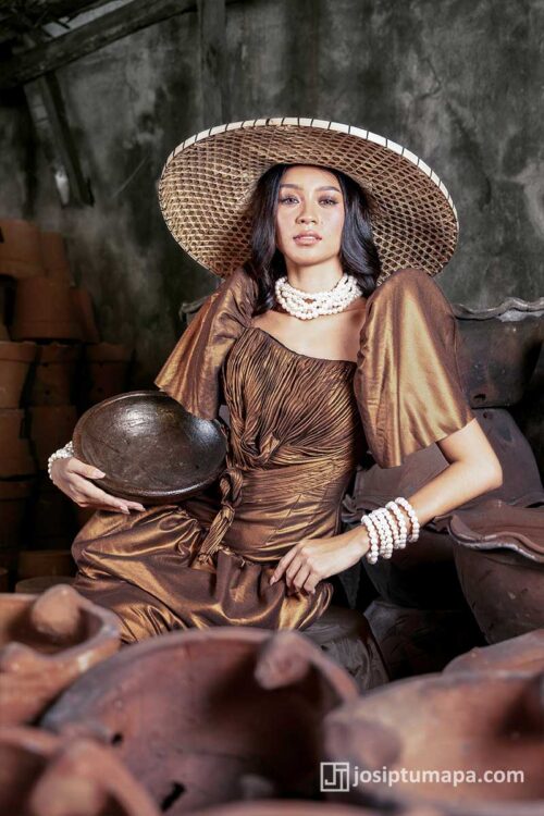 Bronze Filipiniana terno with gathered bodice, classic sleeve volume, and composed formal silhouette