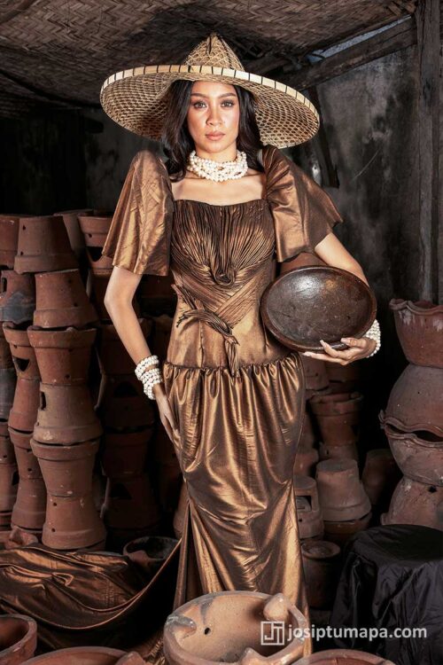 Filipiniana terno in bronze tone with ruched bodice, butterfly sleeves, and softly defined silhouette