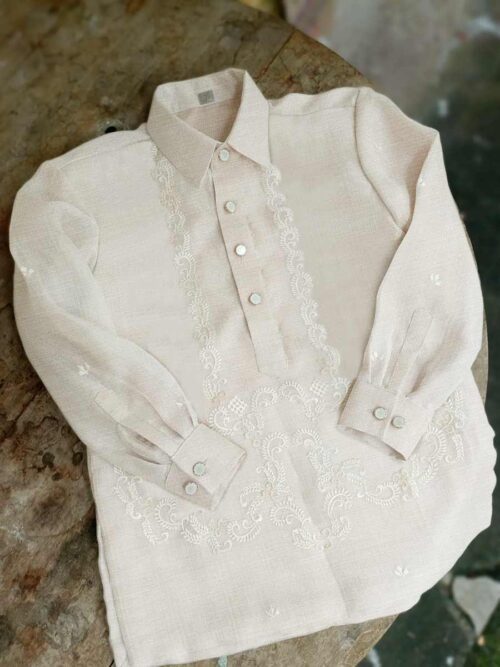 Barong Tagalog in Linen Silk Blend Barong Tagalog in Linen Silk blend with light embroidery and soft texture, shown as a mid-range formal option