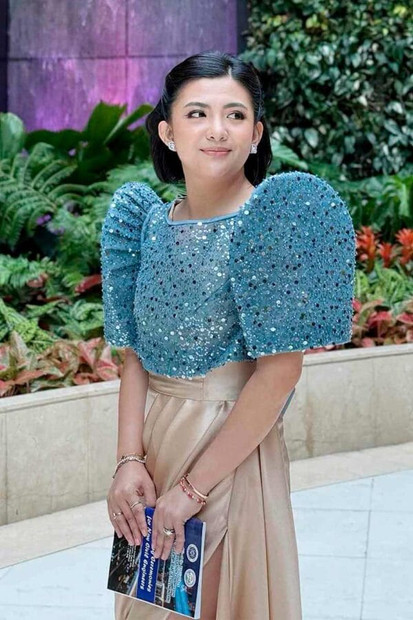 Blue custom Filipiniana with butterfly sleeves, a beaded bodice, and a draped champagne skirt