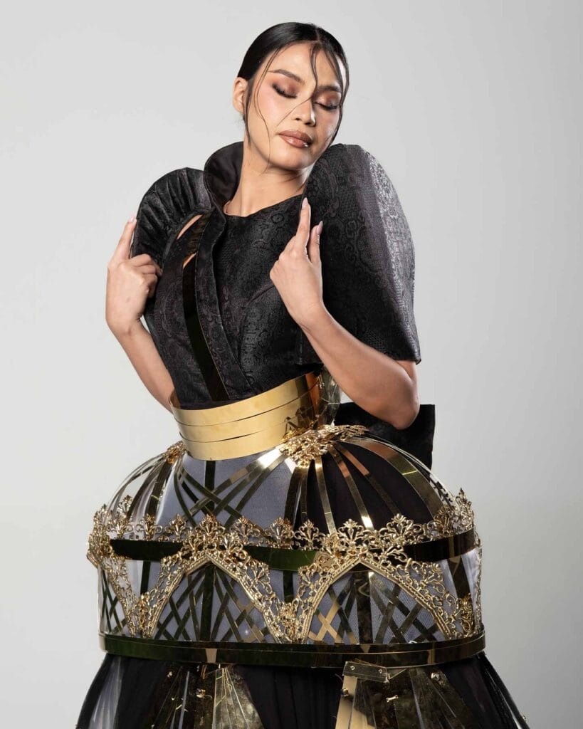 Close view of Filipiniana bodice and skirt connection showing layered transitions and surface contrast