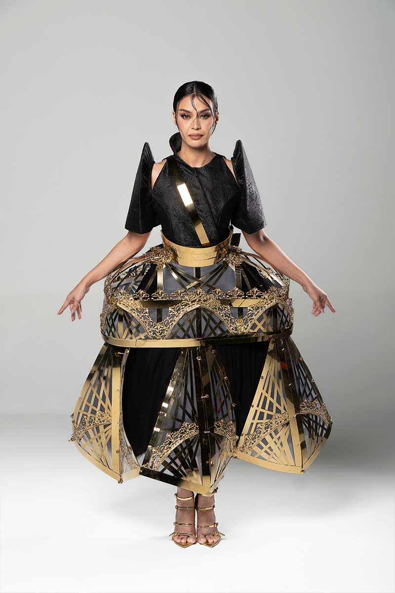 Gilded Geometry Terno from Constructed Light with raised black sleeves, metal waist detail, and geometric skirt panels