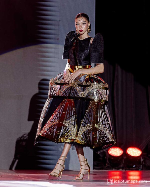 Contemporary Filipiniana terno with angular sleeves and gold-accented geometric skirt