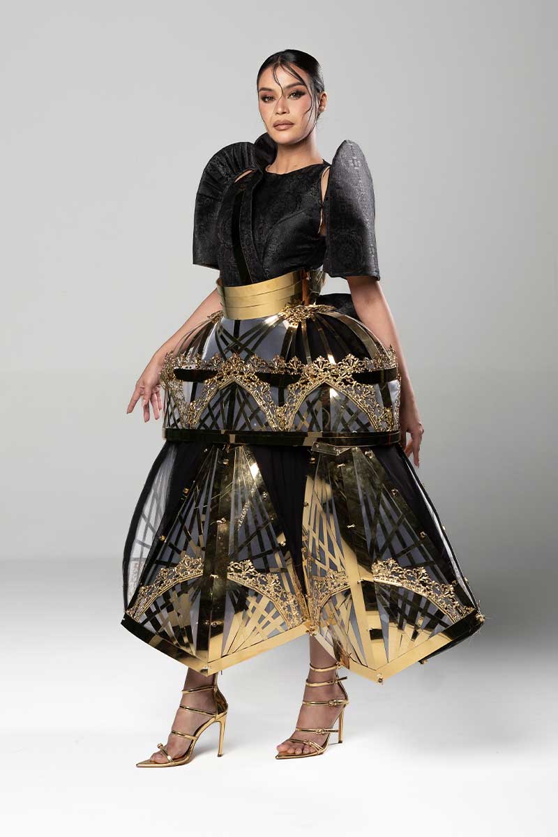 Gilded Geometry Terno with black butterfly sleeves, metallic cage skirt, and Kuna-inspired lower movement