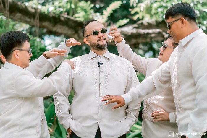 Groom wearing a custom Barong Tagalog in piña cocoon silk with ornament on the shoulders and sleeves
