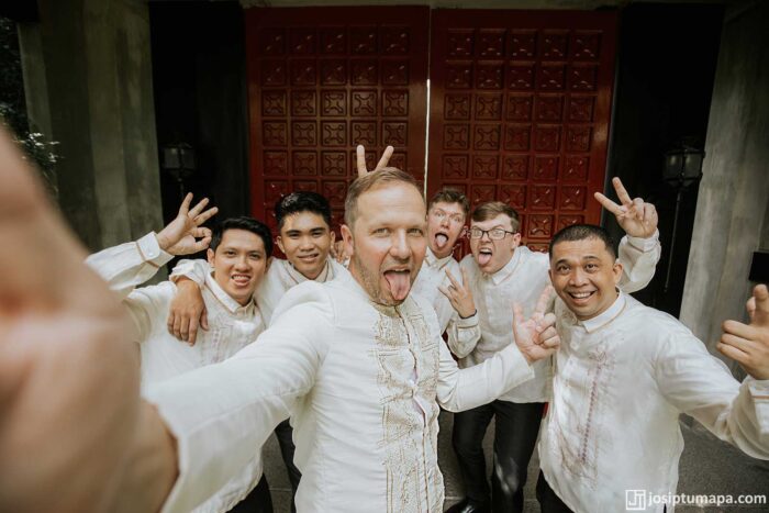 Groom posing with his friends in Barong Tagalog, with the groom’s wedding Barong standing out from the group