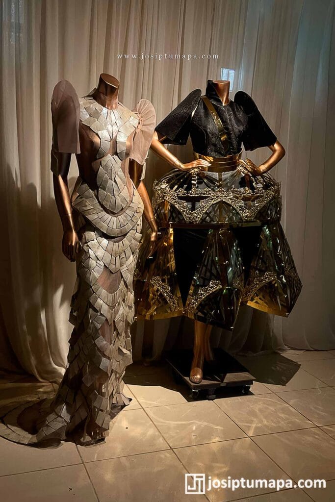 Two modern Filipiniana dresses with butterfly sleeves, shown in contrasting light and black contemporary designs
