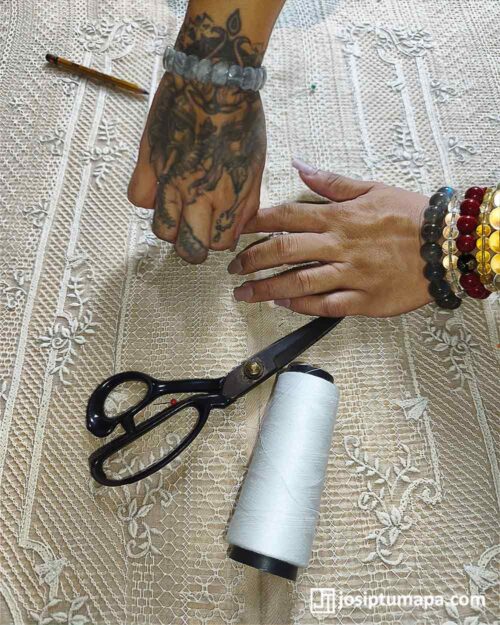 Detailed Calado Barong Embroidery Handwork Process Hands working over detailed calado embroidery with scissors, thread, pins, and sewing tools visible