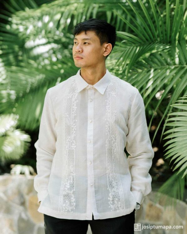 Classic Barong Tagalog in piña cocoon silk worn outdoors, showing the full floral embroidery on the front